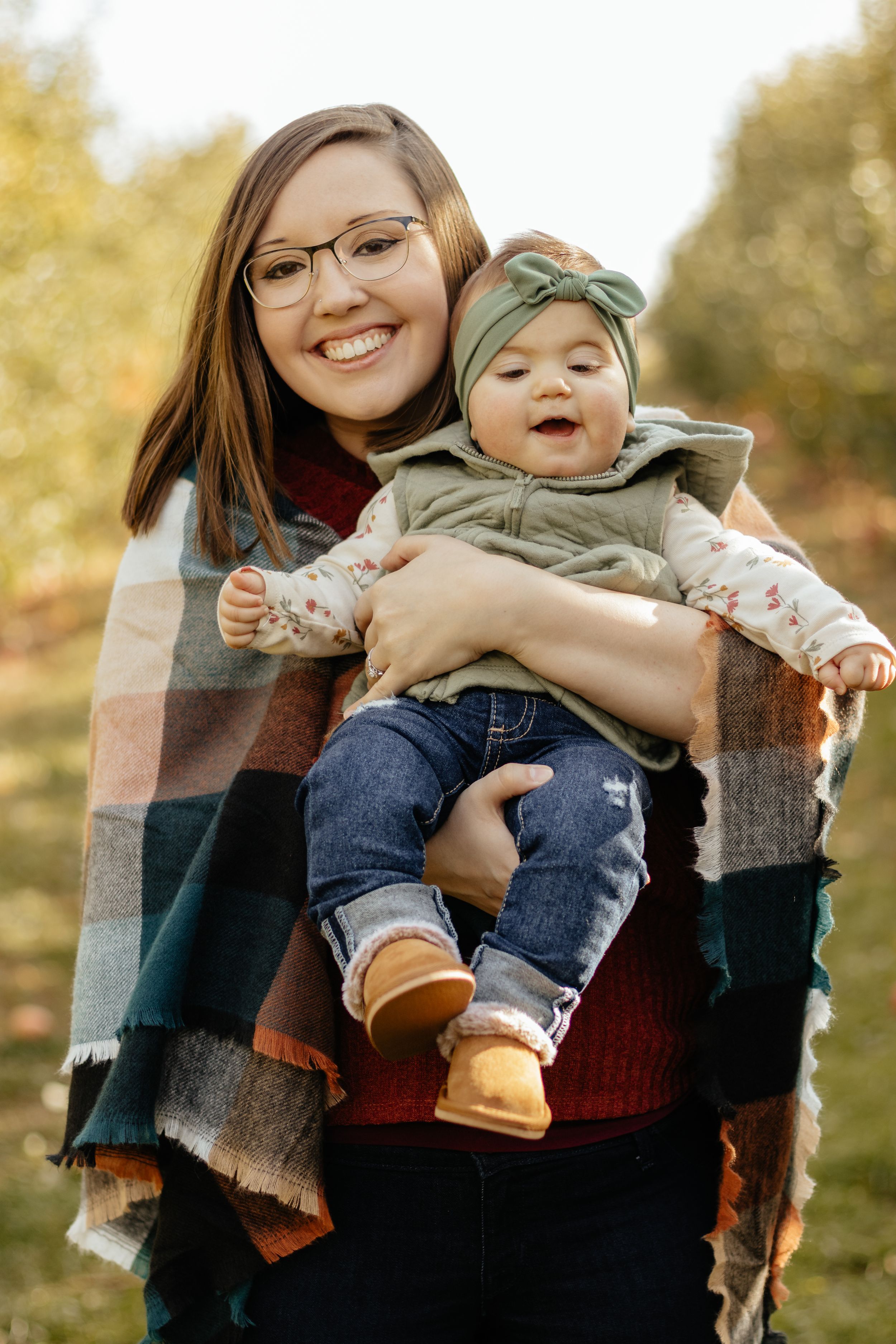 Candid family photography sequence showing loving interactions against autumn foliage.