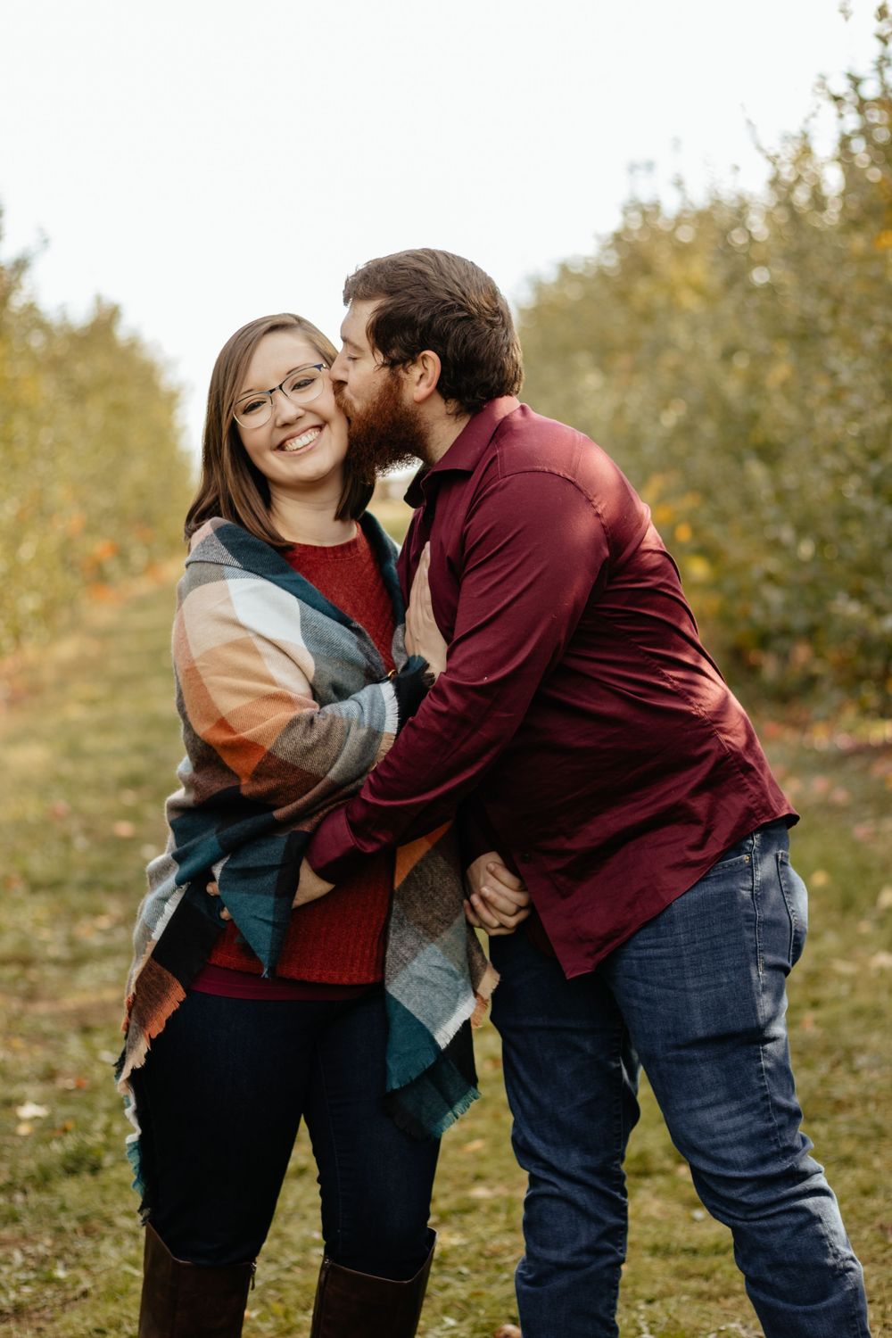 Candid sequence of couple sharing affectionate moments outdoors in autumn setting.
