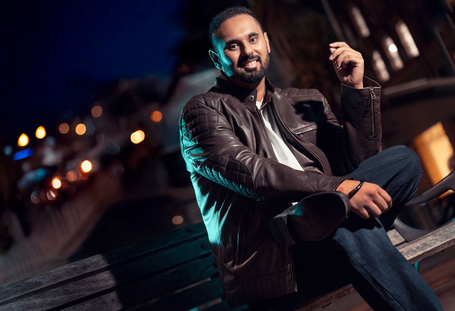 Night portrait series with moody lighting and urban backdrop.