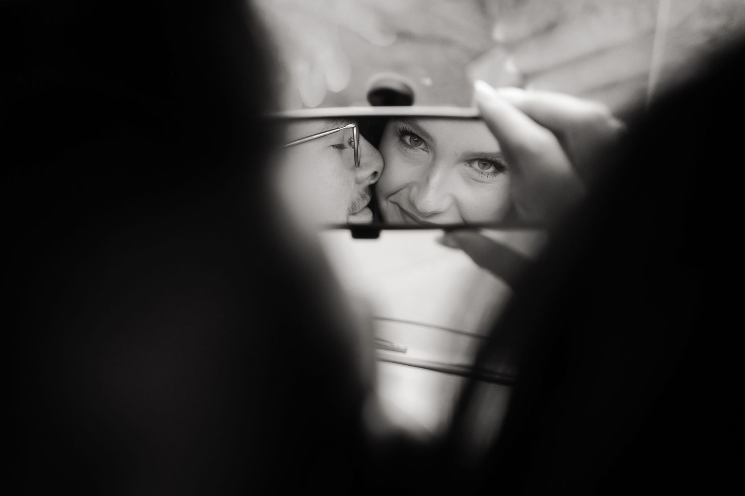A series of blurry black and white photographs arranged in a horizontal row showing abstract shapes and shadows.