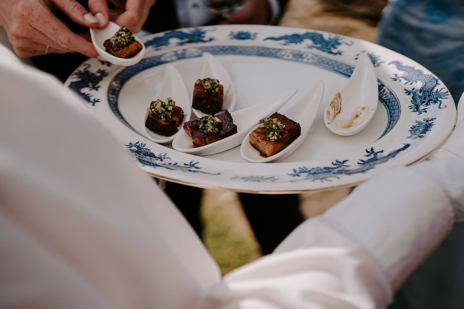 canapes being served to wedding guests at dewsall court in herefordshire