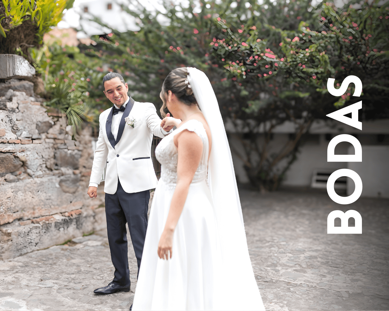 A bride and groom share a romantic moment together during their outdoor wedding photoshoot.