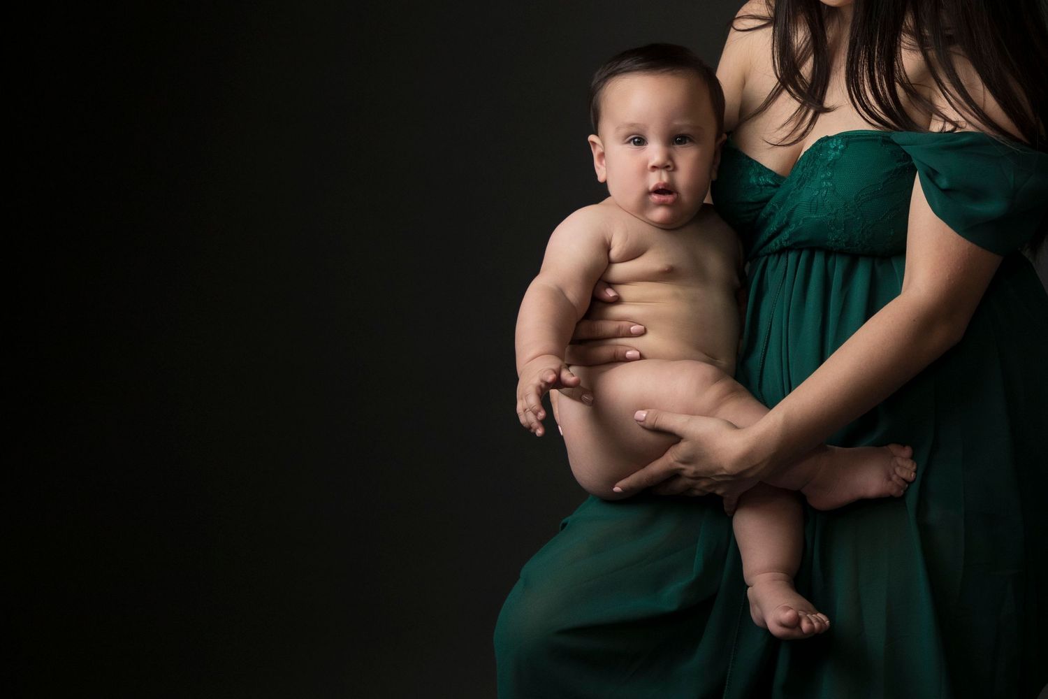 A collection of six intimate black and white portraits showing tender moments between a parent and baby.