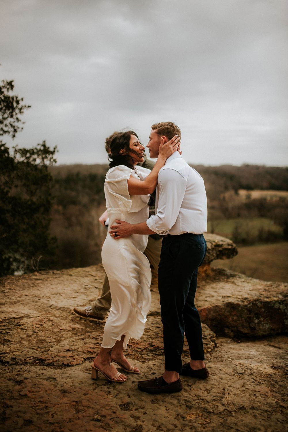 The first kiss of husband and wife during an elopement ceremony with their elopement photographer taking photos in Tennessee.