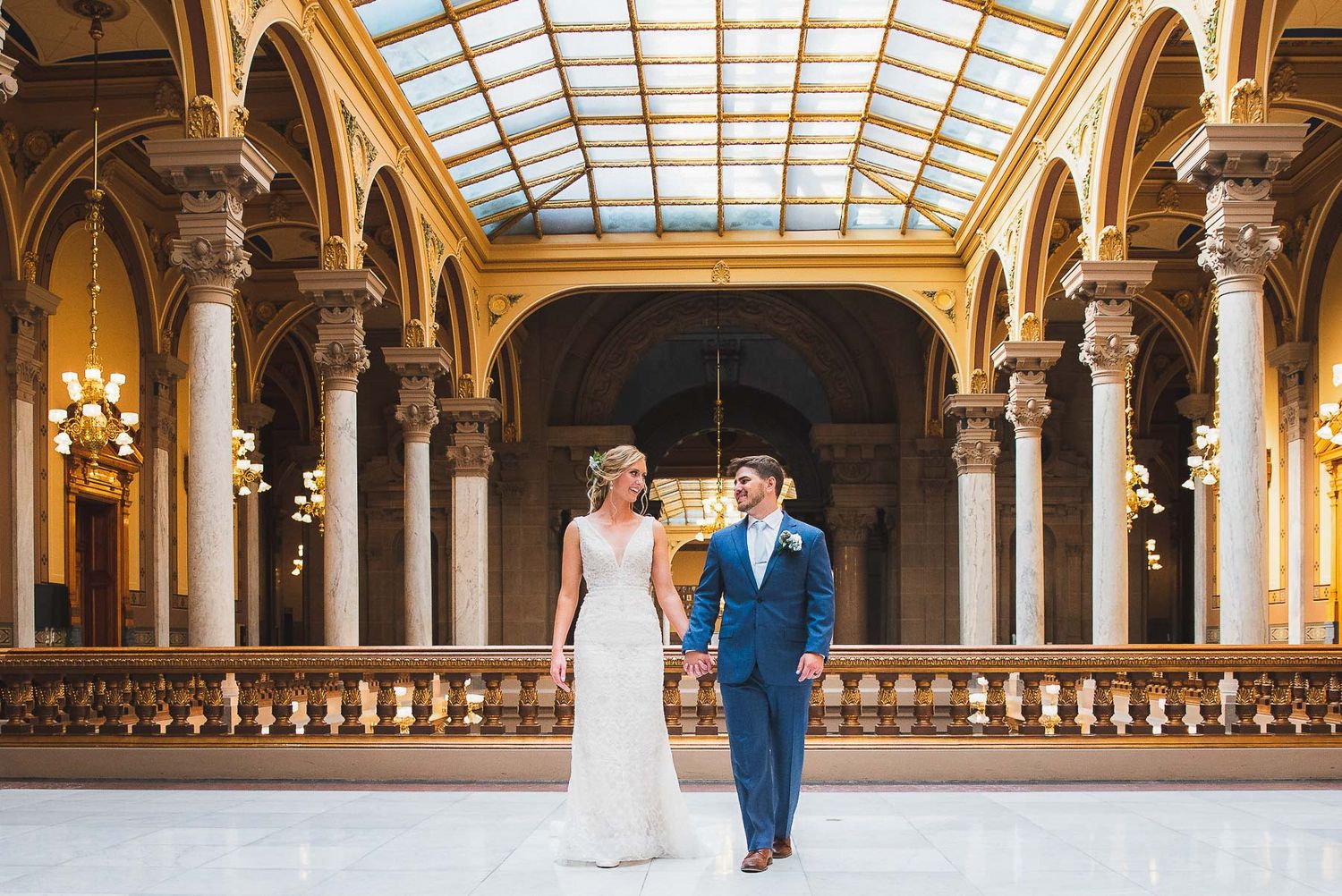 Bride and groom kissing in the Indiana Statehouse
