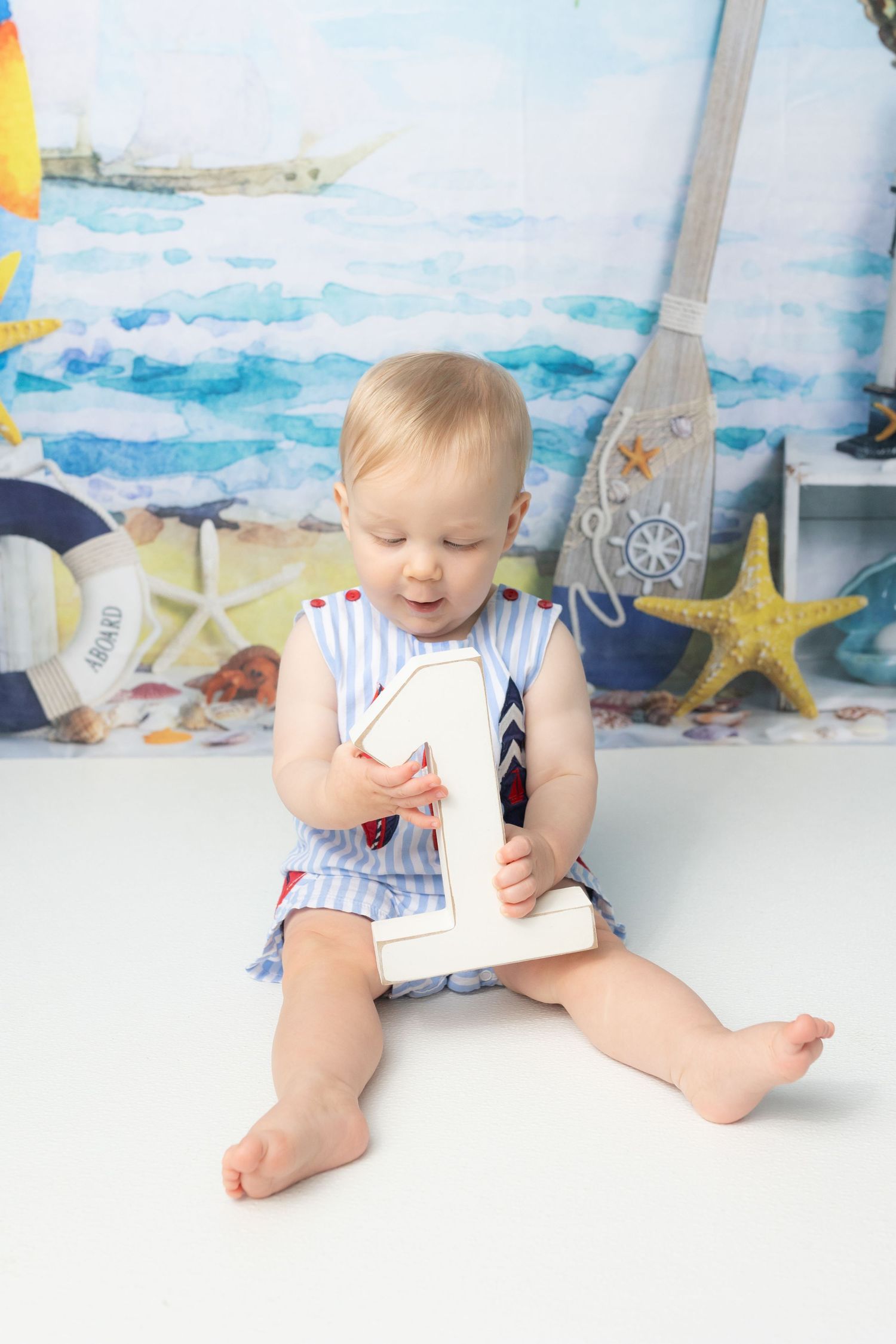 First birthday cake smash photos. Props, photo styling, how to style by Samantha Ann Photo studio photographer swansboro nc and jacksonville