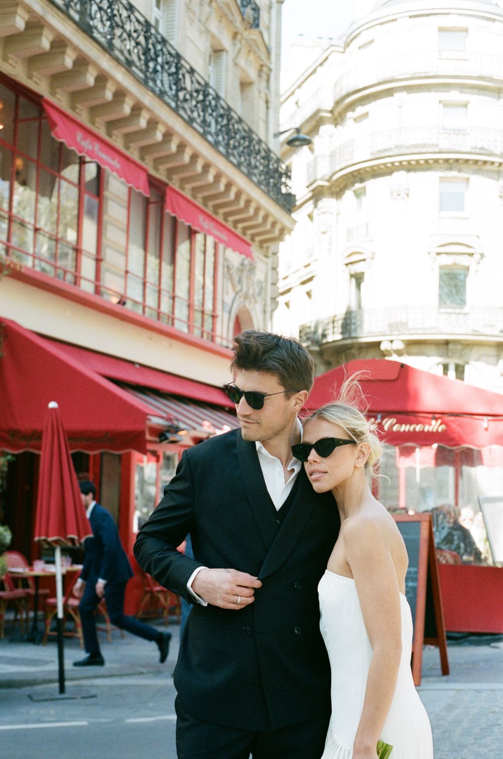 Paris wedding photos with Parisian cafes with red awnings and classic architecture, Paris film photos