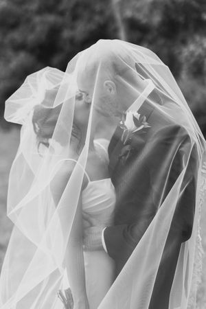 Artistic black and white close-up shots of flowing white bridal veil details.