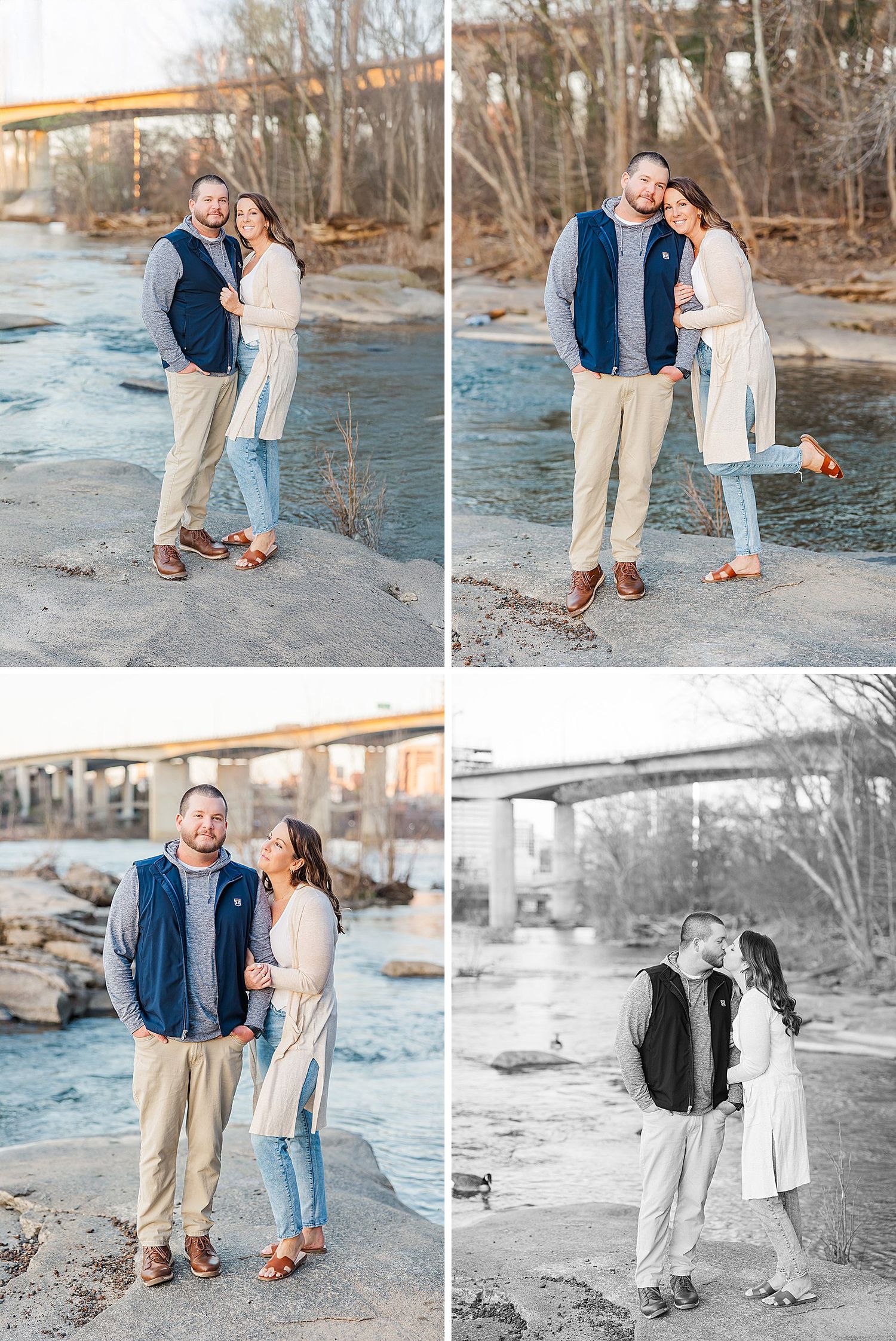 A couple poses together for romantic photos on a rocky riverbank during a winter engagement session in natural light.