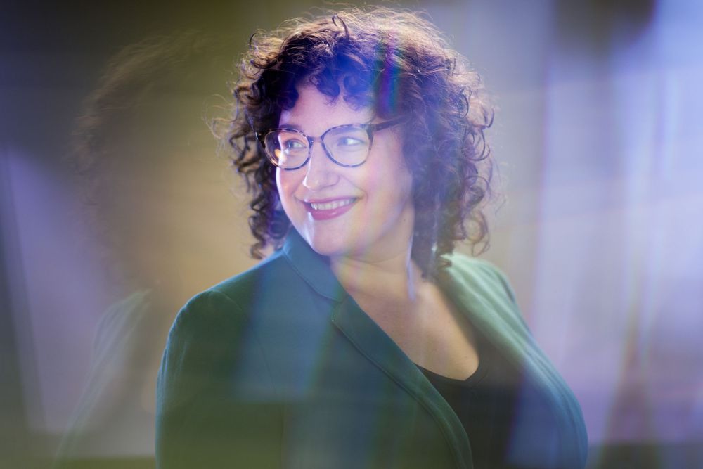 Artistic portrait with dreamy lighting effects and glasses.