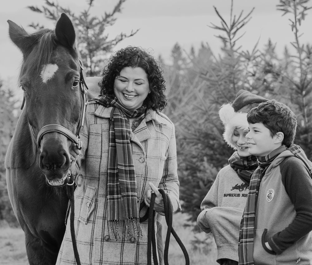 Black and white family portrait with their warmblood mare taken in Tualatin, Oregon Copyright Amanda Barr Photography