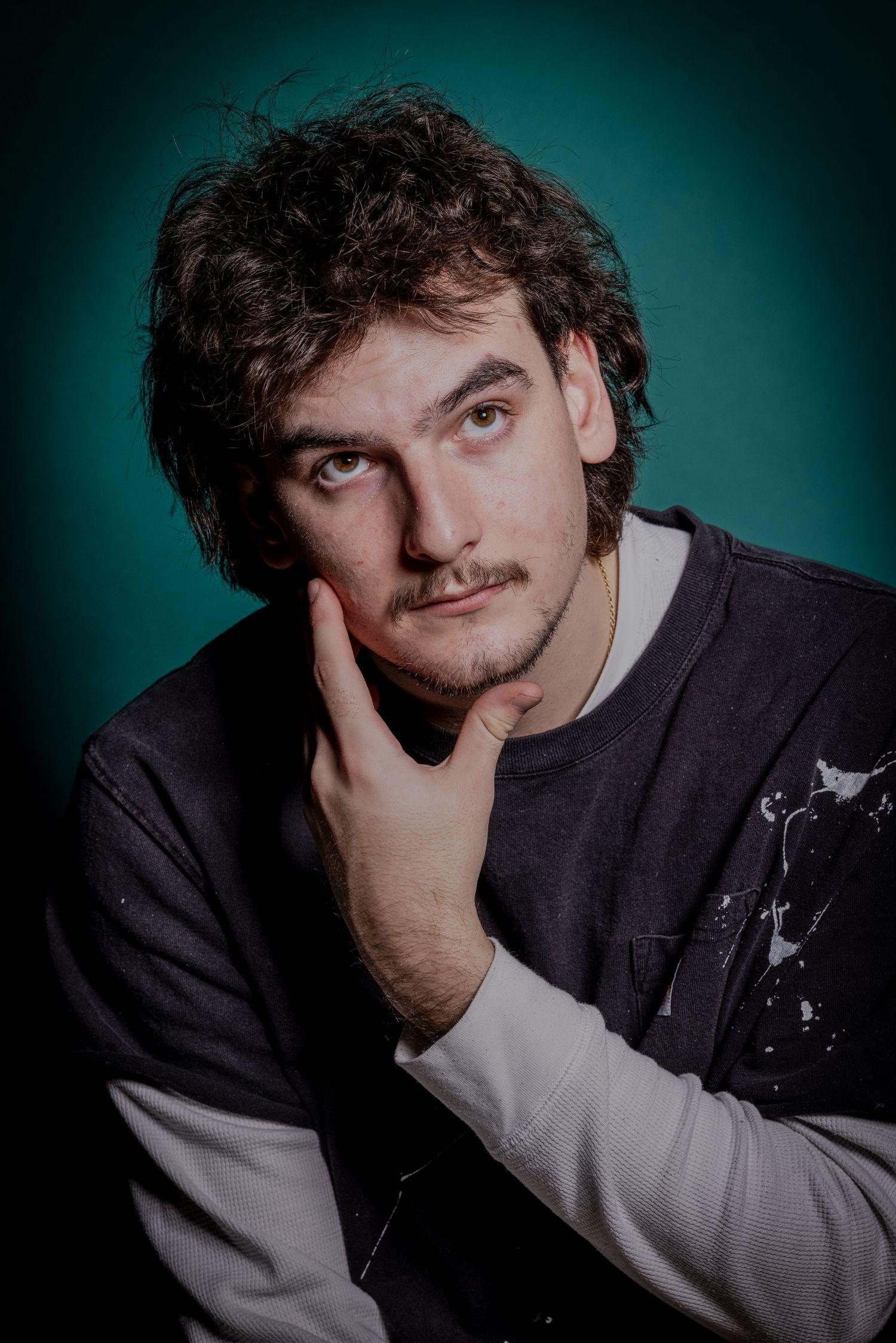 Portrait of Wes with hand on cheek