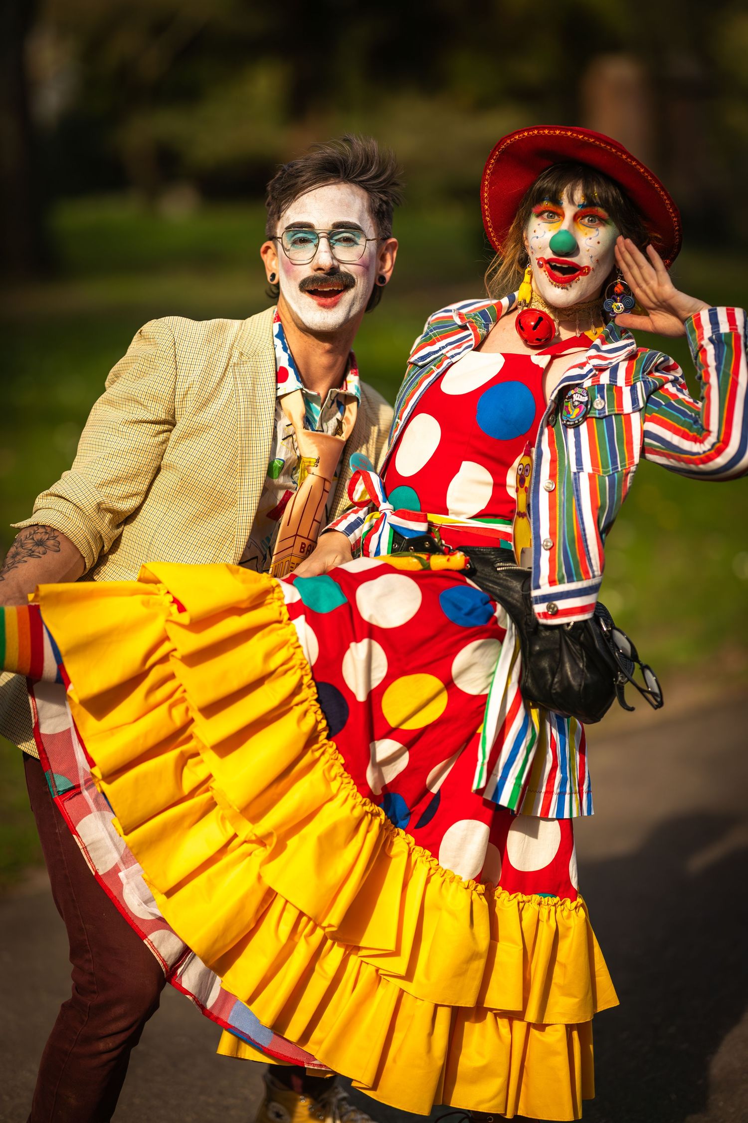 Two clowns strolling through the cemetery