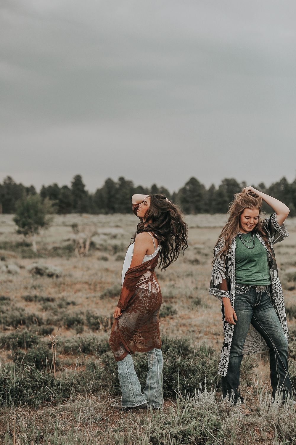 Candid lifestyle photoshoot showing playful moments in a rural field setting.