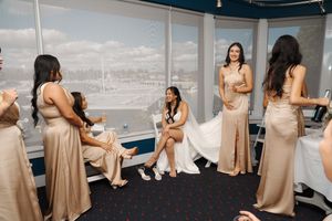 A group of photos showing someone in a beige dress taking photos by a boat at a beach.