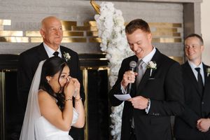 Candid reactions and laughter during wedding party photo session.