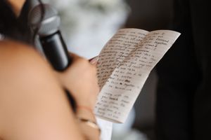 Wedding letter being read aloud showing handwritten words and emotional expressions.