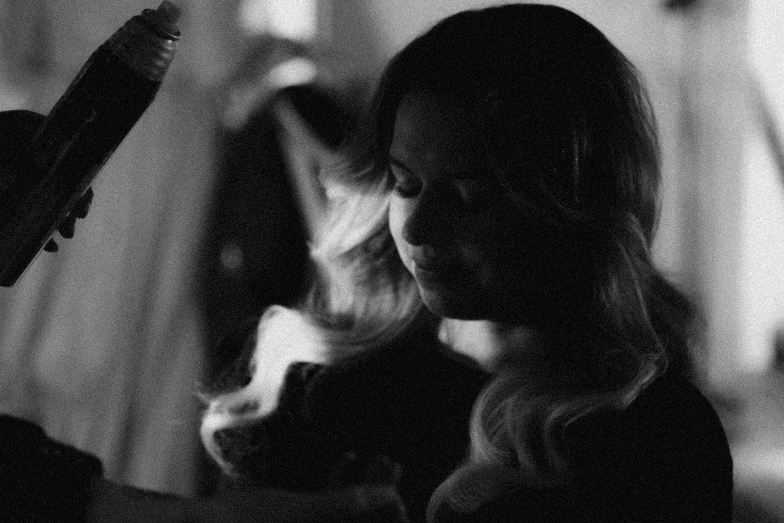 Black and white photographs of people in silhouette and profiles with dramatic lighting and shadow effects.