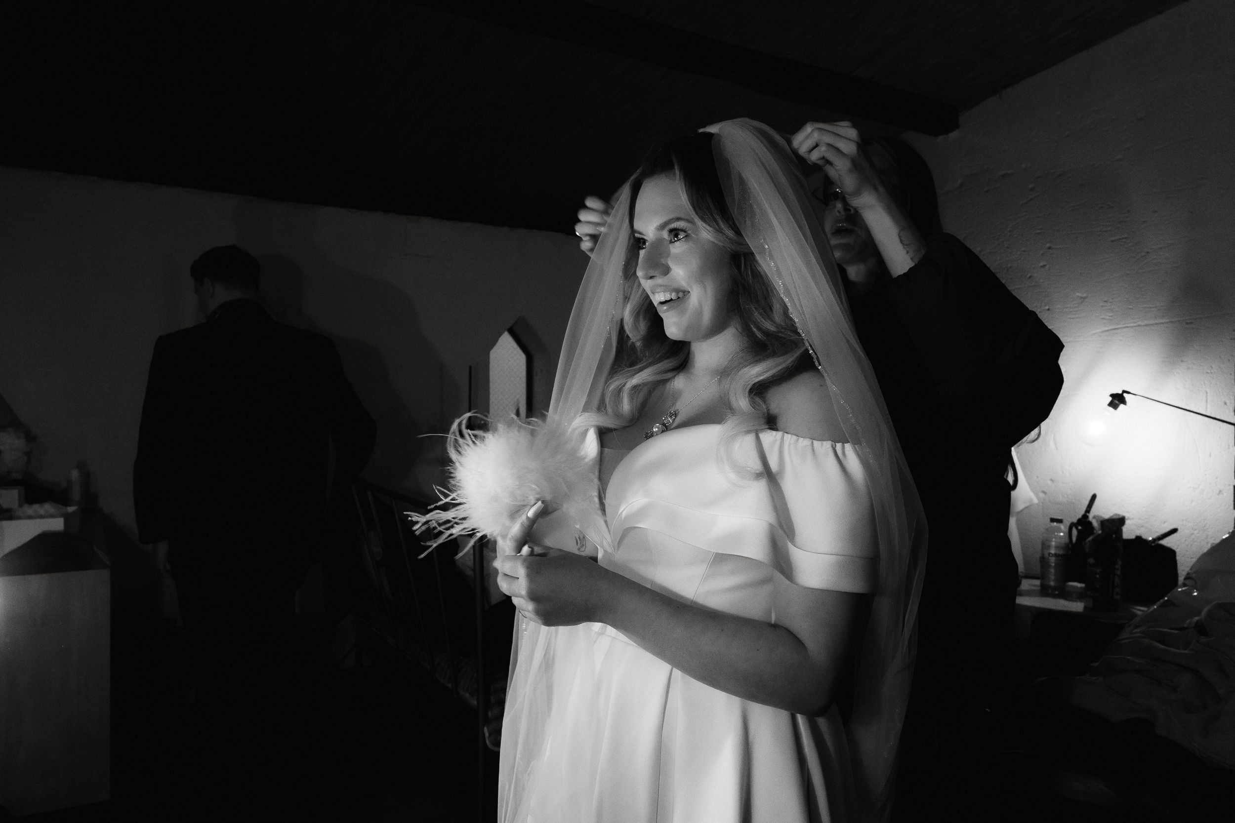 Black and white photo montage capturing candid moments during a wedding celebration.