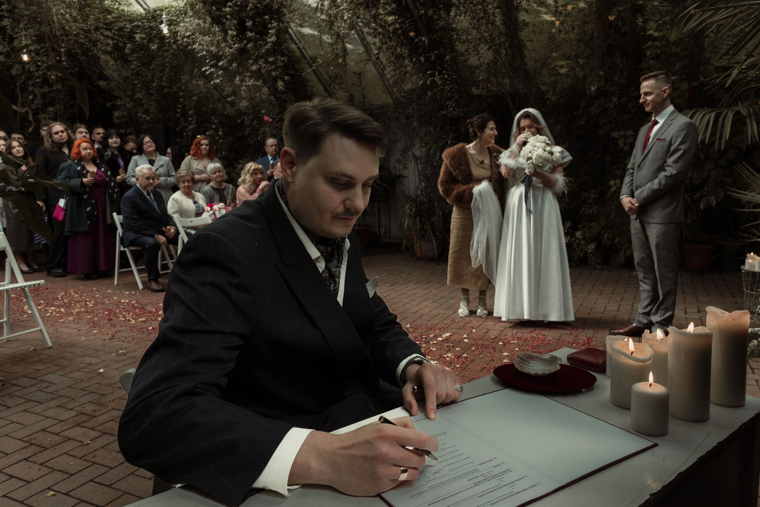 A collage of wedding ceremony moments shows guests signing papers and intimate candlelit settings at an evening celebration.