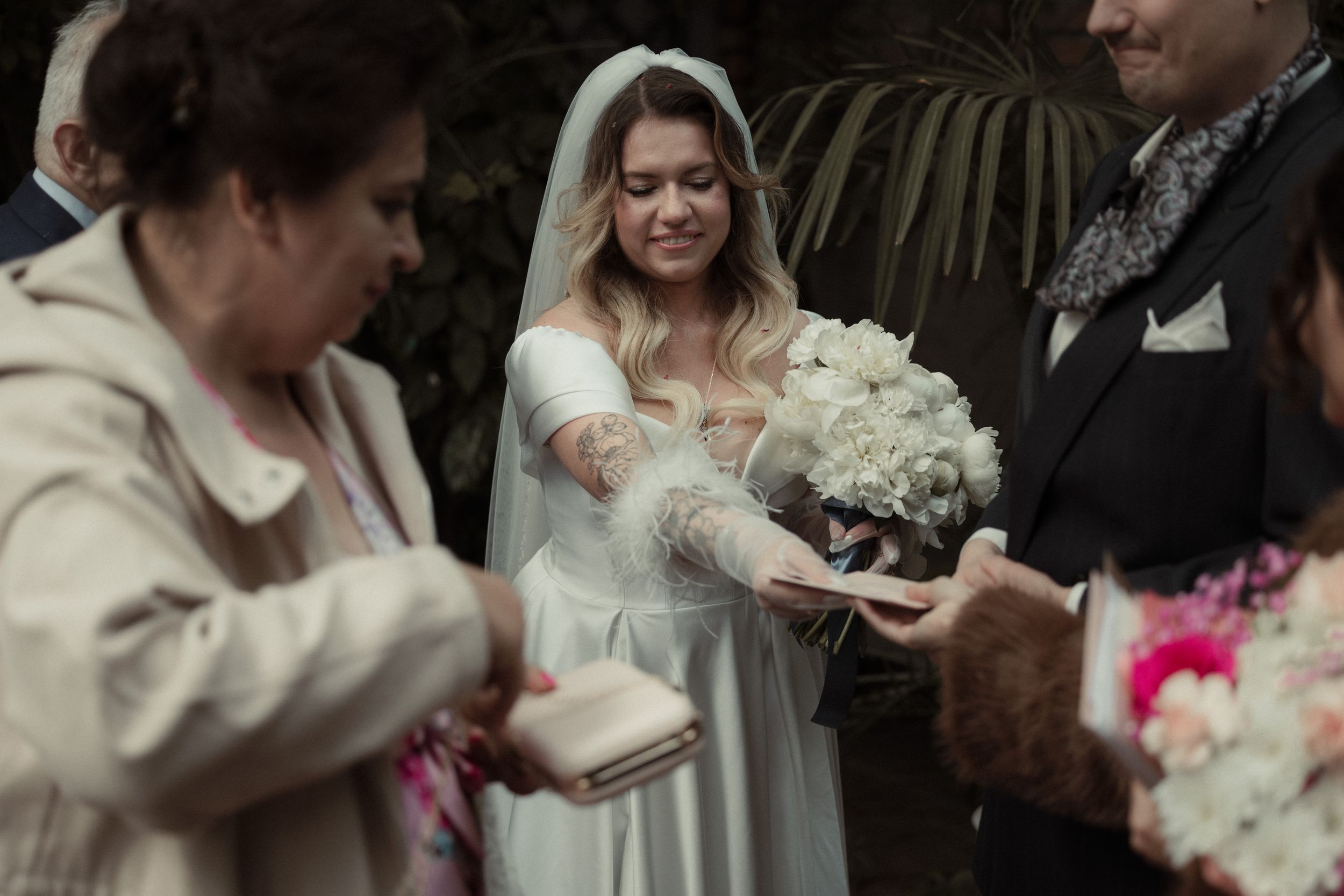 Emotional moments shared between participants during an outdoor wedding ceremony surrounded by loved ones.