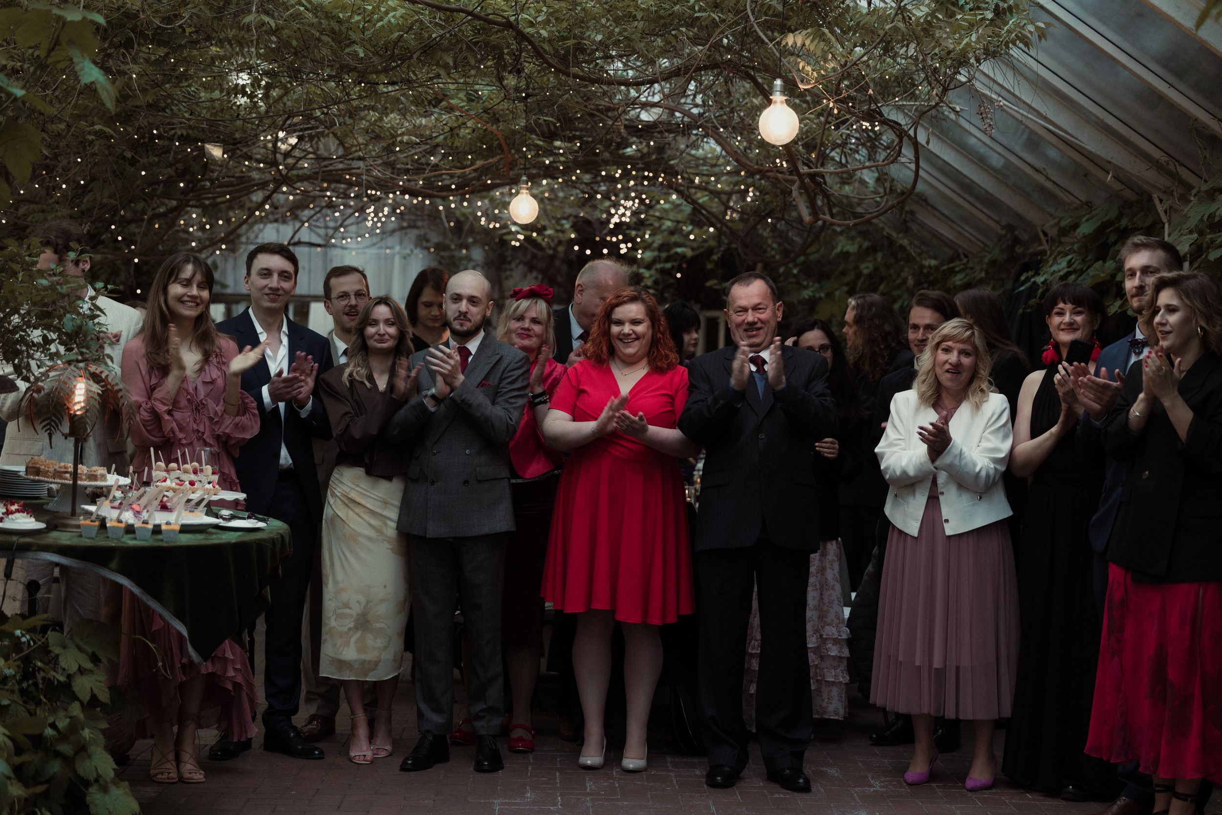 Panoramic photo collage captures wedding guests gathered in formal attire outside during celebration moments.