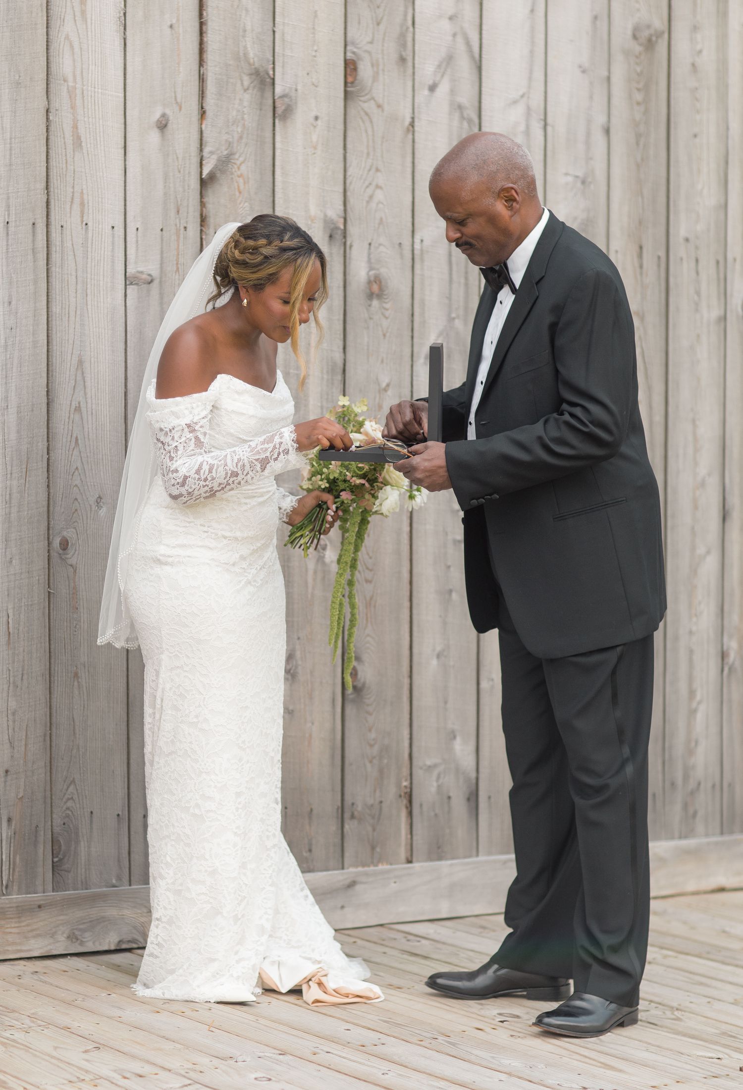 A sequence of wedding first look photos showing a couple's emotional reaction by a wooden fence backdrop.