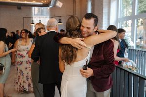 Couples practicing dance moves in a ballroom during a group dance lesson class.