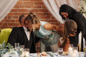 Sequence of candlelit moments showing two people leaning close together at a romantic table setting.