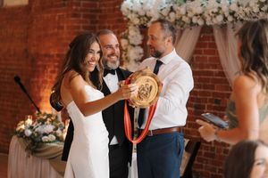 Collage of wedding moments featuring dancing couples and festive celebrations against exposed brick walls with floral decorations.