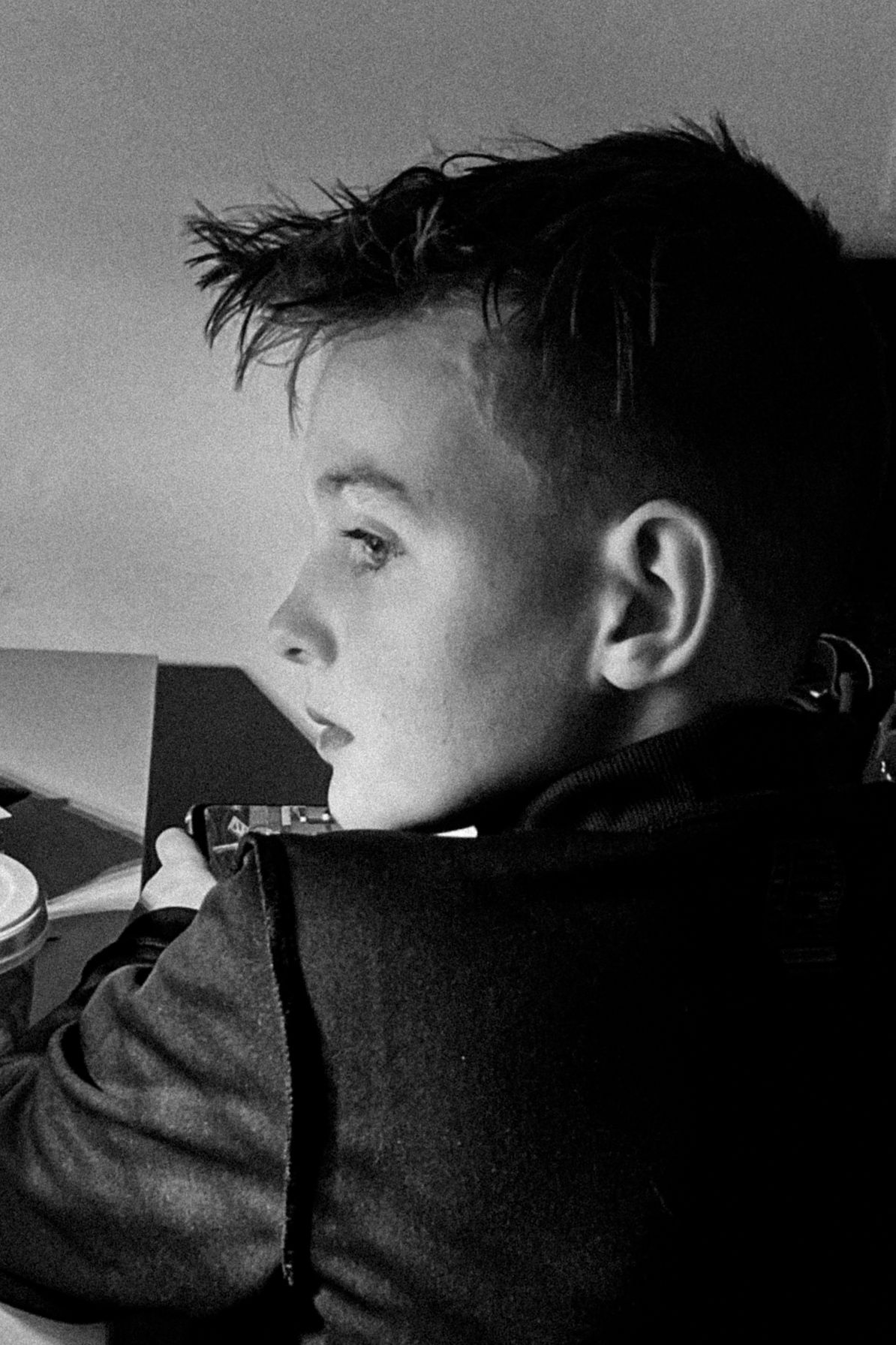 Dramatic black and white silhouette sequence showing a child's profile in shadow.