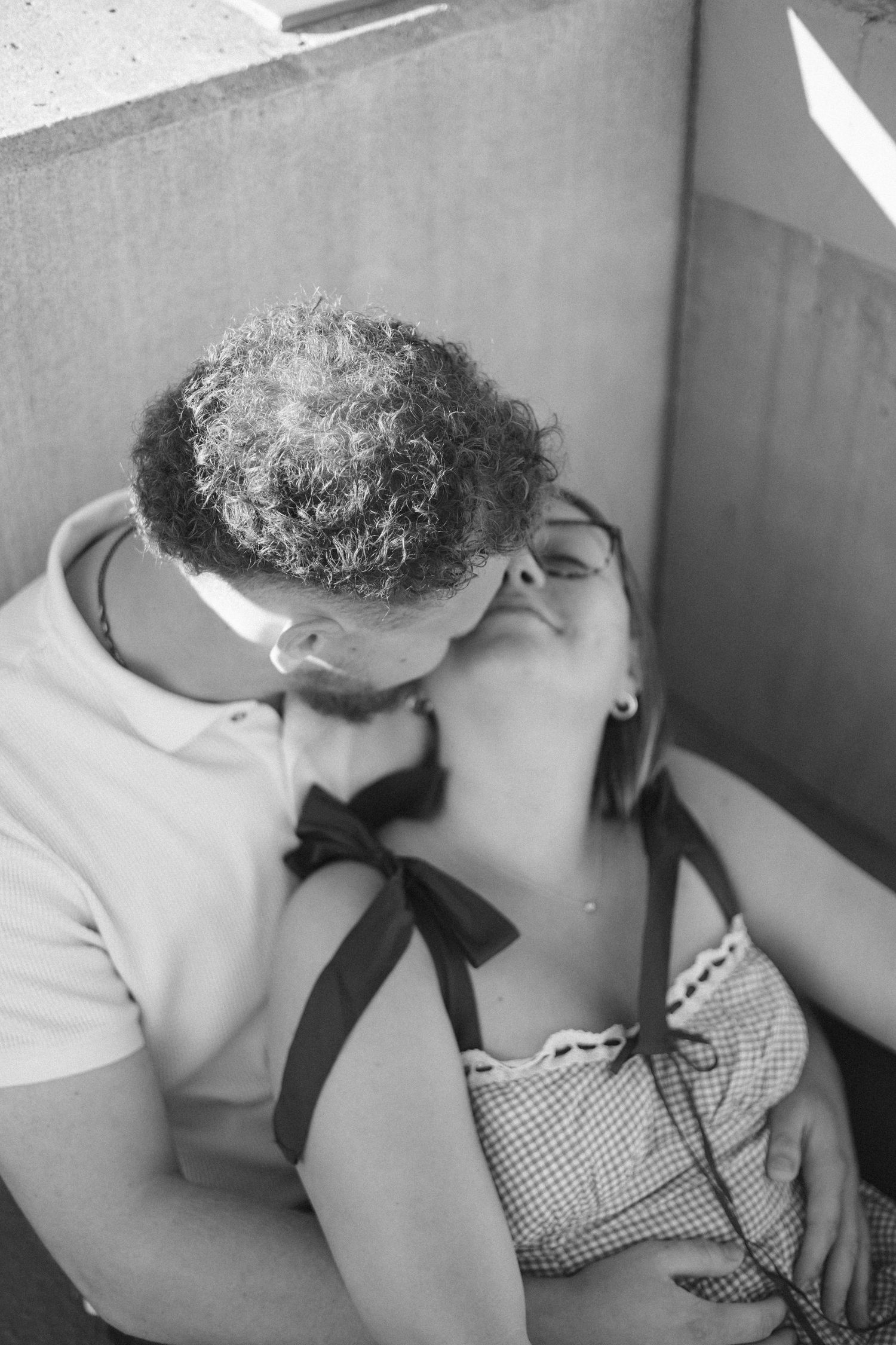 Outdoor uptown Normal summer engagement photos in Normal, Illinois
