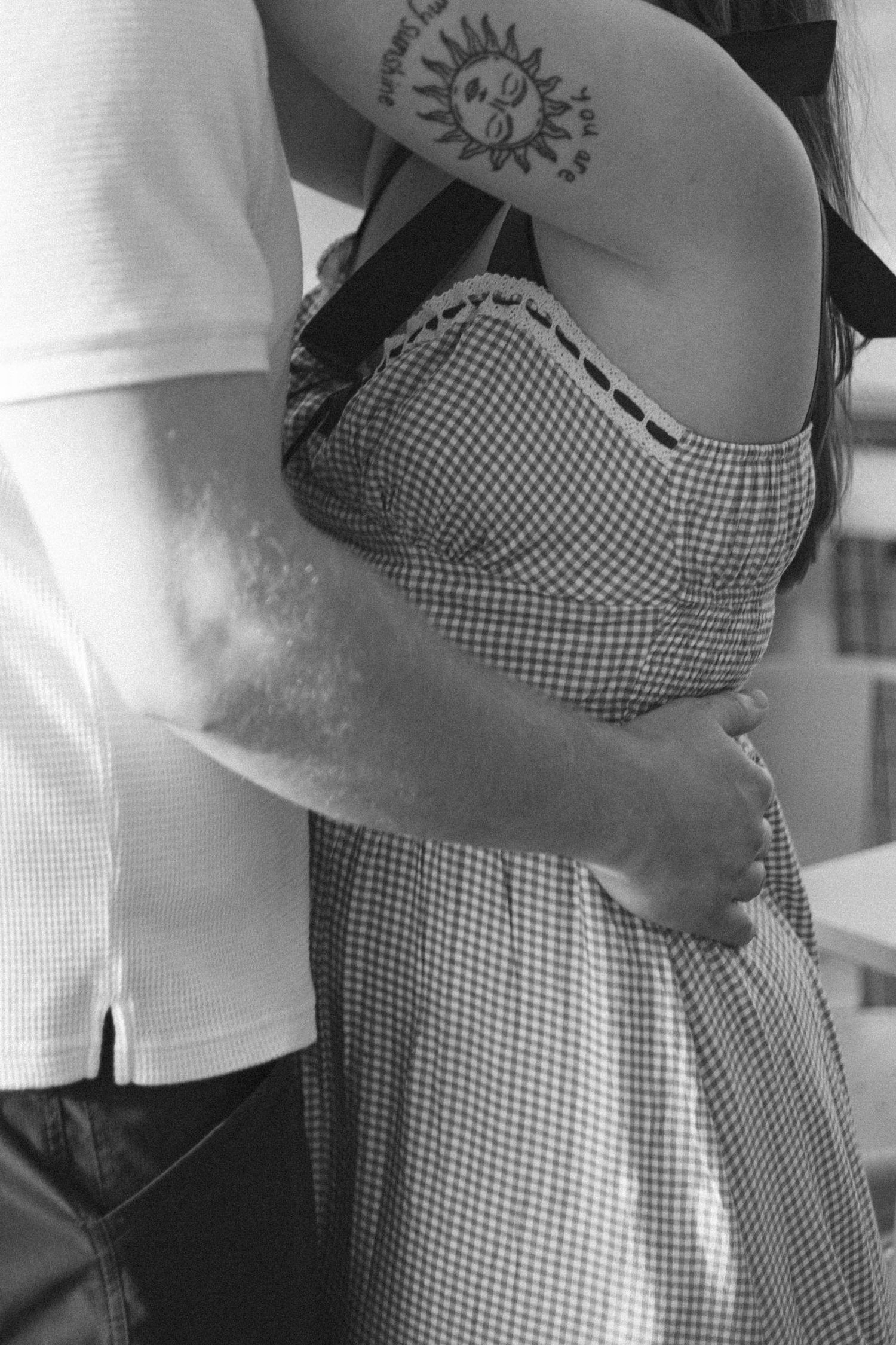 Outdoor uptown Normal summer engagement photos in Normal, Illinois