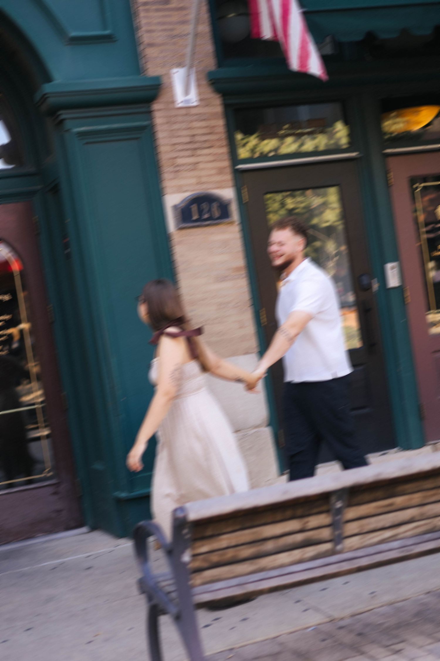 Outdoor uptown Normal summer engagement photos in Normal, Illinois