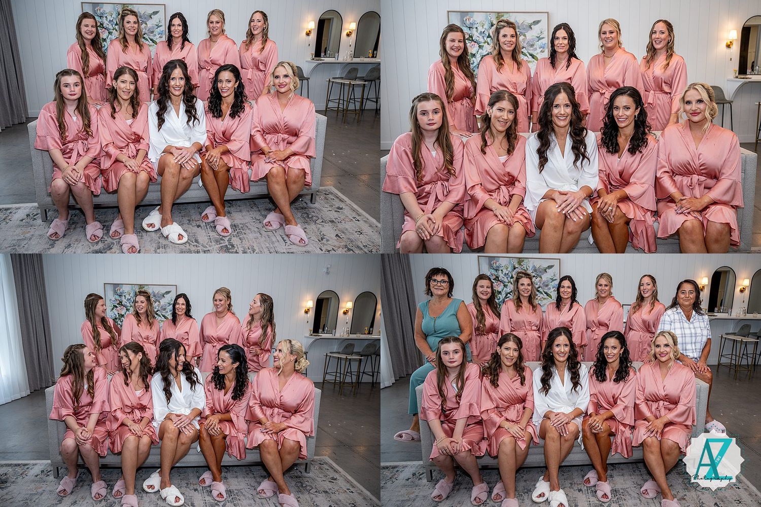 Bridal party wearing matching pink robes sitting together on gray couch for pre-wedding photos.
