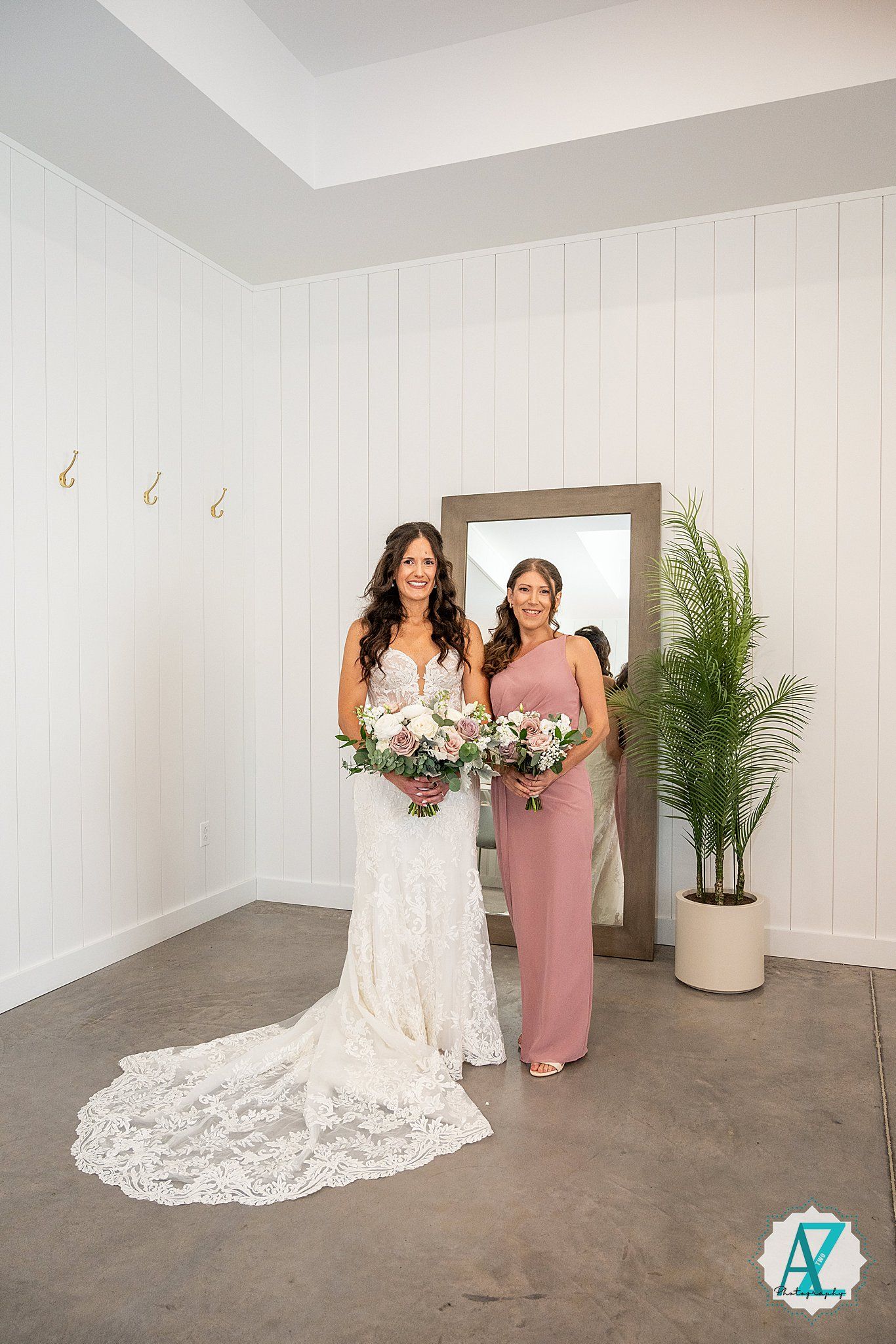 Four poses of a bride in a white lace wedding dress with long train standing in a minimalist white studio setting.