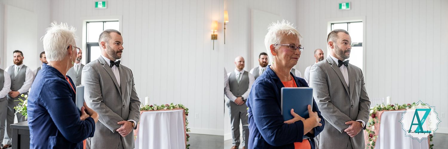 Wedding ceremony guests lined up in formal attire inside a bright reception hall.