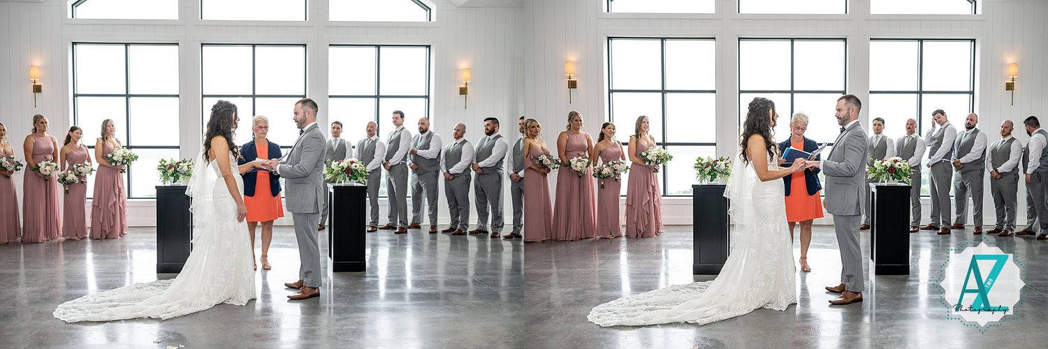 Large panoramic view of a wedding ceremony venue with guests gathered in a bright interior space.