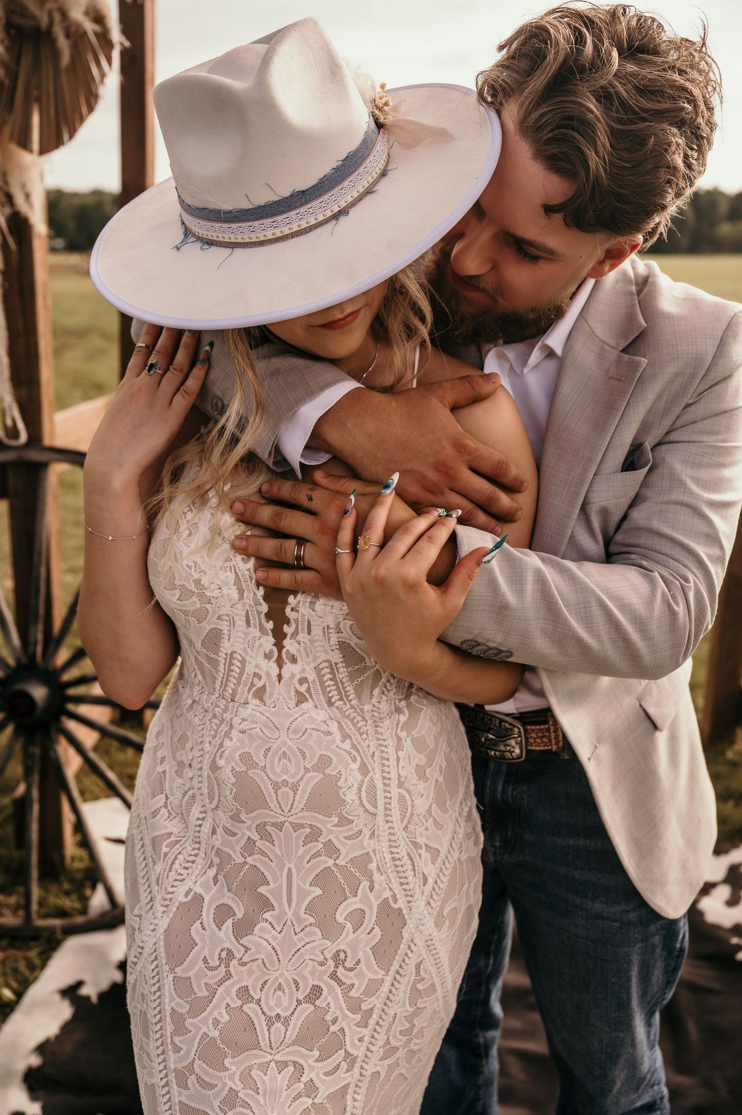 A series of romantic wedding photos showing intimate moments between a bride in lace and groom in western attire.