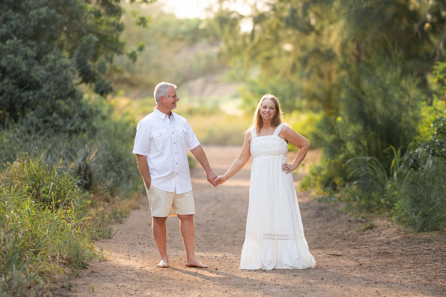 Maui couple photographer photo against beautiful Maui sunset beach by ohwowfotos.