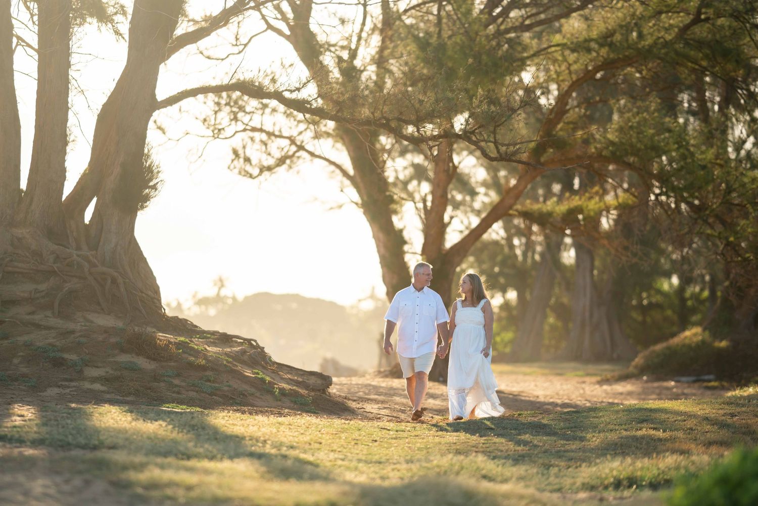 Maui couple photographer photo against beautiful Maui sunset beach by ohwowfotos.