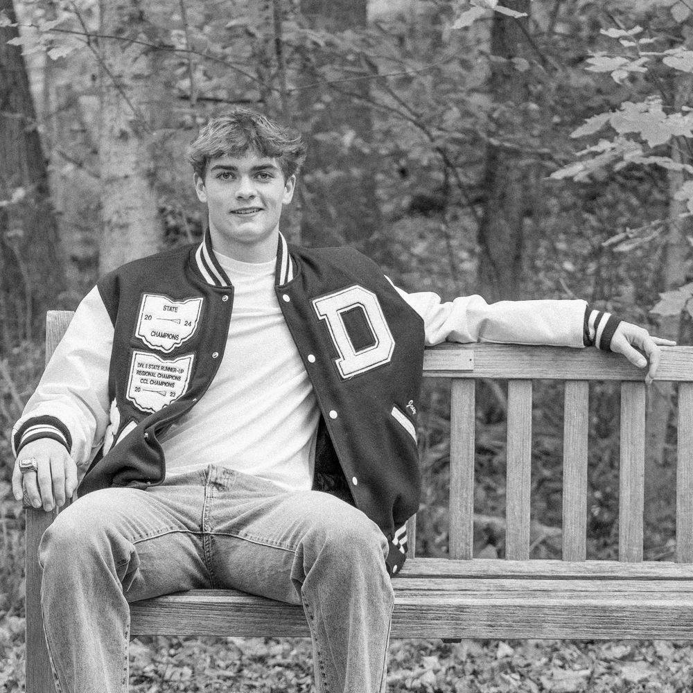 Black and white photo series showing several poses of someone sitting on a wooden bench in an outdoor setting.