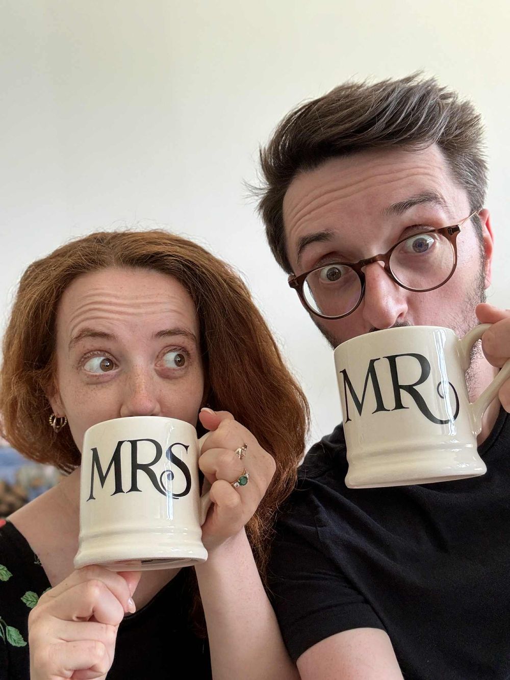 Four cropped photos show two people playfully drinking from matching Mr and Mrs coffee mugs in sequence.