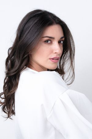 Artistic portrait series featuring flowing dark hair against a clean white background.