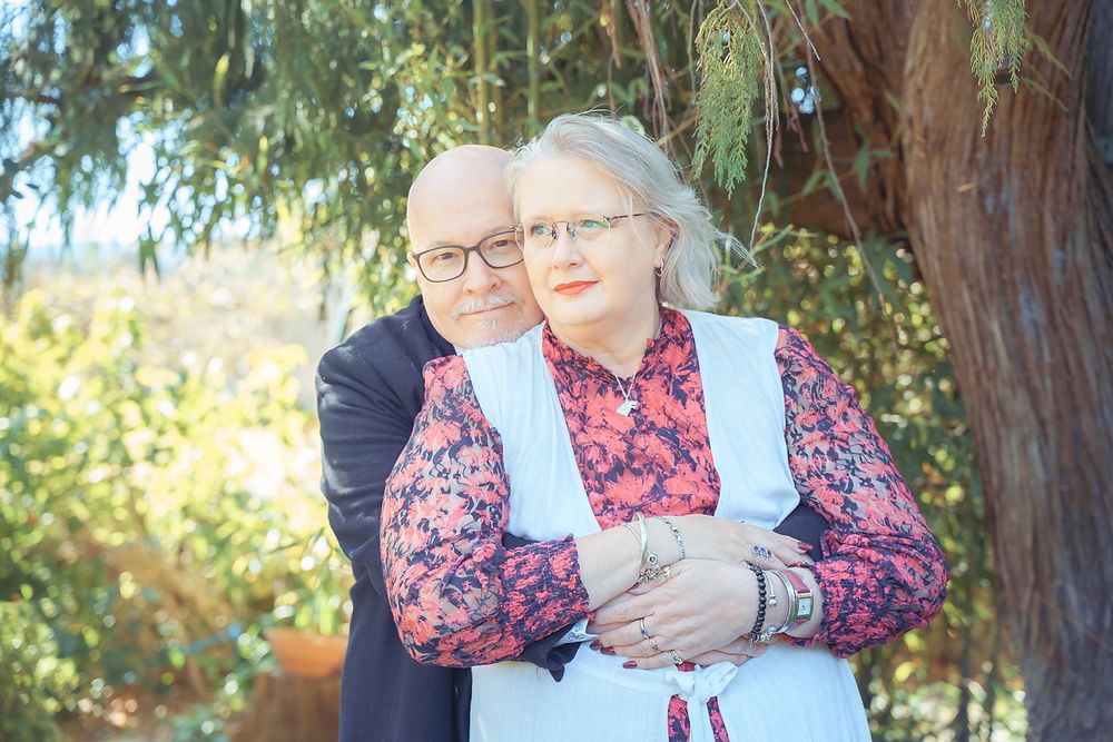 Sequence of three images showing a couple sharing a sweet moment outdoors in a park setting with trees in the background.