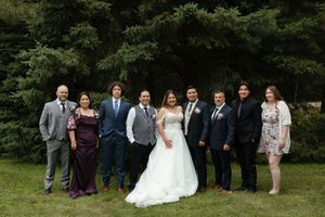 A collage of outdoor wedding party photos showing family and friends posing together in a garden setting.