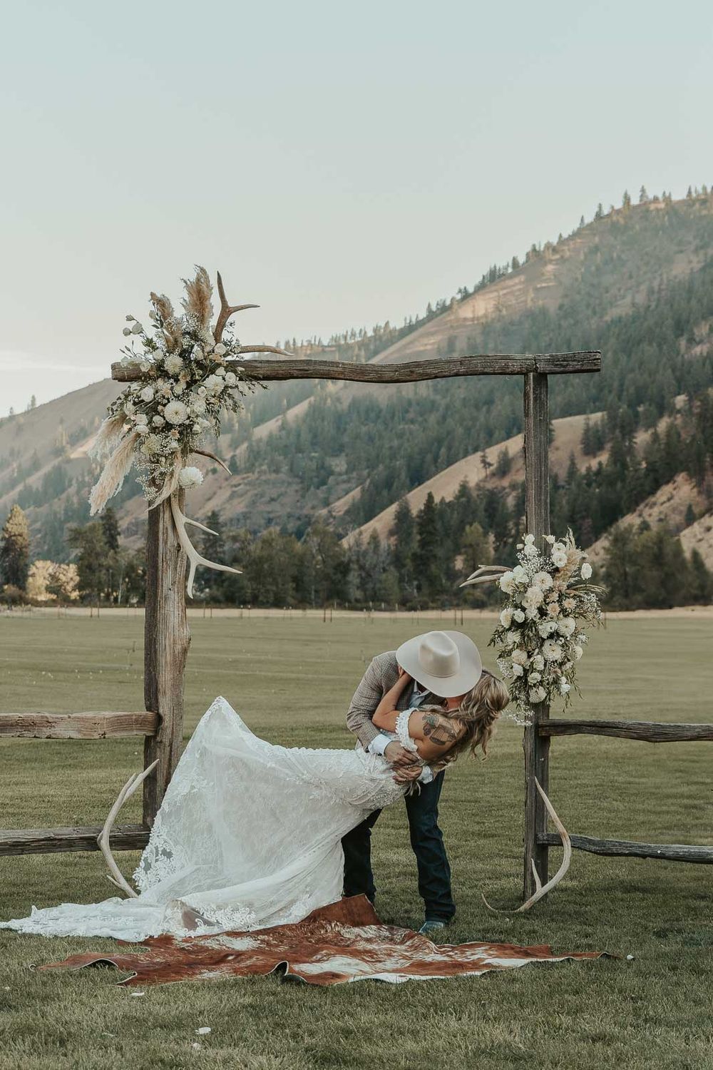 Heartfelt ceremony moments at Cody and Jessica's wedding in Naches, WA. Captured by a Spokane wedding photographer. First kiss dip