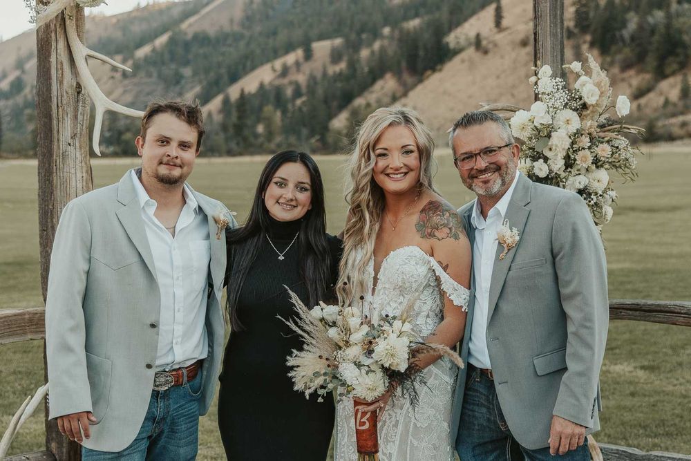 Joyful moments from wedding reception in rustic wedding barn at the American Homestead. Photographed by a spokane wedding photographer