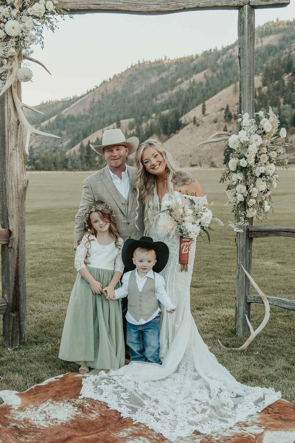 Family photo moments from wedding reception in rustic wedding barn at the American Homestead. Photographed by a spokane wedding photographer