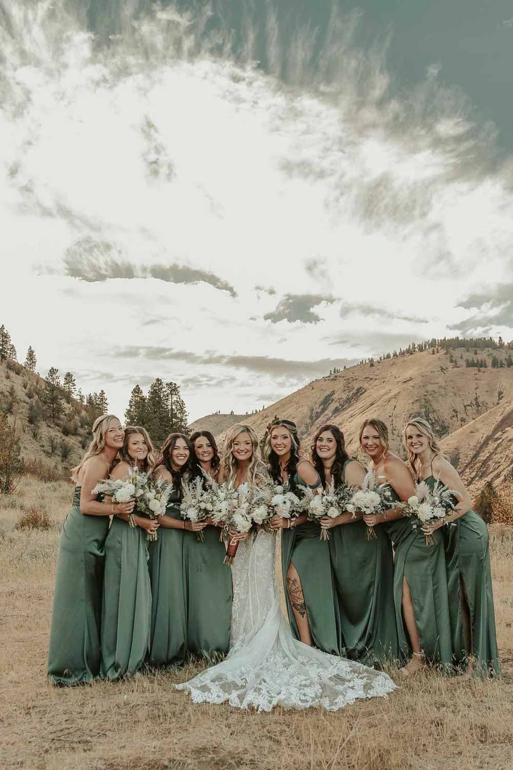 Bride and her bridesmaids in sage-green dresses candid moments at the American Homestead wedding venue. Spokane wedding photographer